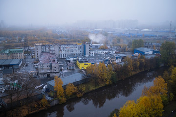 View of industrial area of the city with factories. Environmental problems.