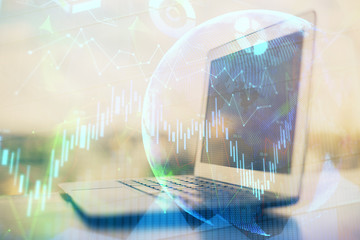 Stock market graph and table with computer background. Multi exposure. Concept of financial analysis.