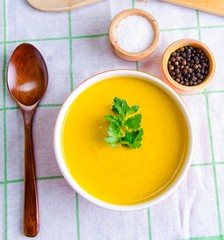 Pumpkin soup served on the table in bowl