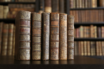 old books on wooden shelf.
