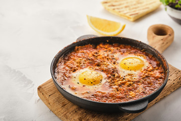 Shakshuka, Fried Eggs in Tomato Sauce. Traditional Mediterranean Fried Eggs. Israeli cuisine.