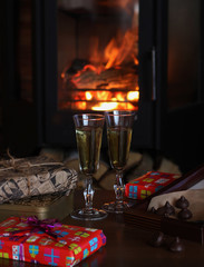 Champagne glasses on the background of the fireplace