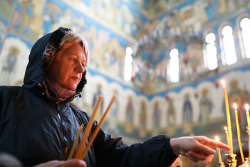 Elderly woman in orthodox church