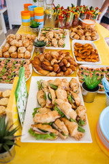 buffet for celebration birthday food on plates, home made sandwiches and decorations