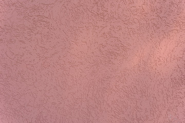 Abstract light red cement wall textured background