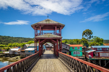 Mechuque, Chiloe Archipelago, Chile - Bridge and Stilt Houses (Palafitos) in the Town of Mechuque,...