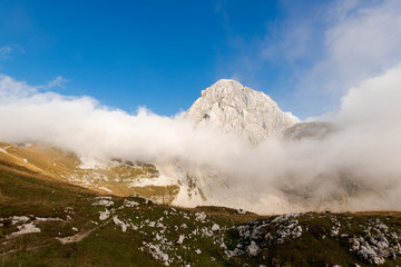 Mangart Peak in Julian Alps Mountains. Dramatic Weather