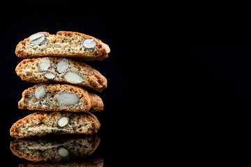 Italian Traditional Almond Biscuits Cantucci. Studio Shot on Black Background