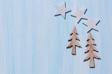Christmas tree on blue background. Christmas or winter concept with copy space.