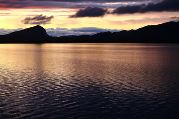 Mountain range Marsfjaellen seen in sunset from lake Kultsjon in Vasterbotten, Sweden