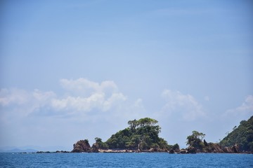 Island, Ocean views near Phuket Thailand with Blues, Turquoise and Greens oceans, mountains, boats, caves, trees resort island of phuket Thailand. Including Phi Phi, Ko Rang Yai, Ko Li Pe and other is