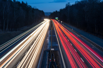 white and red car light trails on motorway