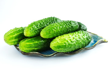 Cucumber gherkins on a white background. The concept of vegetarianism and healthy eating. Place for text. Close-up.