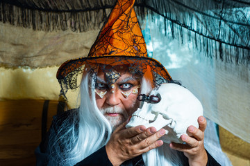 Halloween bearded man with blood make-up. Halloween concept. Devil man with skull with bloody face....