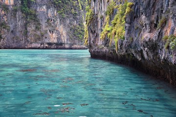 Fototapeta na wymiar Island, Ocean views near Phuket Thailand with Blues, Turquoise and Greens oceans, mountains, boats, caves, trees resort island of phuket Thailand. Including Phi Phi, Ko Rang Yai, Ko Li Pe and other is