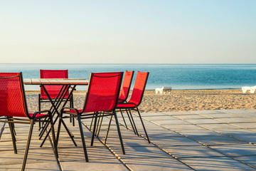 Outdoor beach restaurant at tropical resort.Tables and chairs in a cafe on the beach