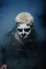 Tableau sur plexiglas  halloween make up. scary man ready for party. strange male with skull painted on his face in black Studio  © goldeneden