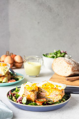 Croque Madame - hot french sandwich with ham, melted emmental cheese, fried egg and bechamel sauce with salad. Delicious breakfast. food, sandwich, cheese, breakfast, bread