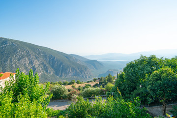 Fototapeta na wymiar View from famous town of Delphi down to coastal city of Itea