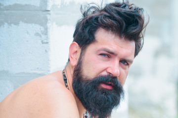 Morning after few drinks can be harsh sometimes. Brutal man with beard. Headache and overworking....