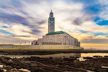 View of Hassan II mosque at sunset - The Hassan II Mosque or Grande Mosquée Hassan II is a mosque...