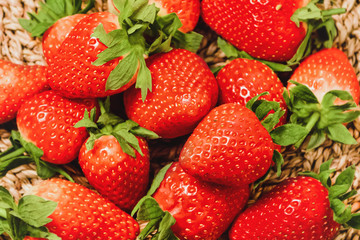 Fresh strawberries on a wicker background, in a wicker basket. Natural look