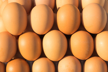 Brown chicken eggs laid out on the counter of the market, store, supermarket