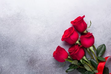 Poster Red rose flowers bouquet on stone background Valentine's day greeting card Copy space © lizaelesina