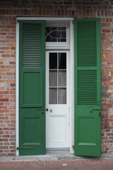 green shutters on brck building in French Quarter