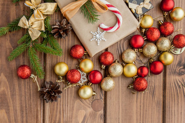 Christmas gift box, food decor and fir tree branch on wooden table. Top view with copy space
