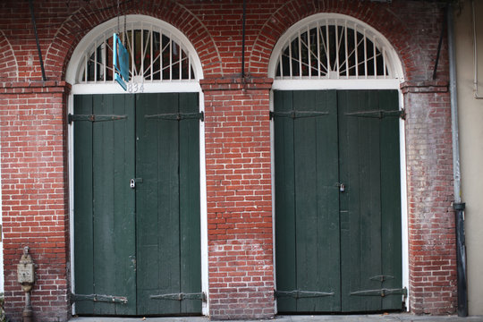 Green Shutters On Old Brick Building In French Quarter New Orleans