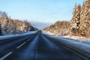 Fototapeta na wymiar winter road landscape sunlight snow