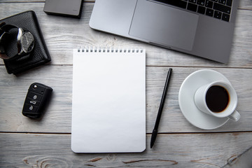 bright male banner / header with a stylish male workspace with laptop, smartphone, modern men's accessories on a wooden table, top view / flat lay