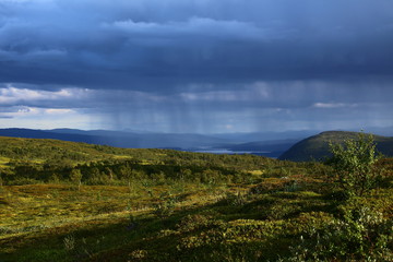 Sun and rain in Blasjofjalls nature reserve near the Wilderness Road in Sweden