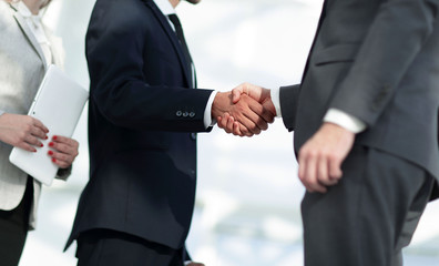 Business handshake and business people.