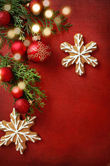 christmas ornaments on red background, border with copy space