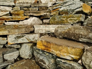 Dry stone wall texture background, traditional way of building fences.