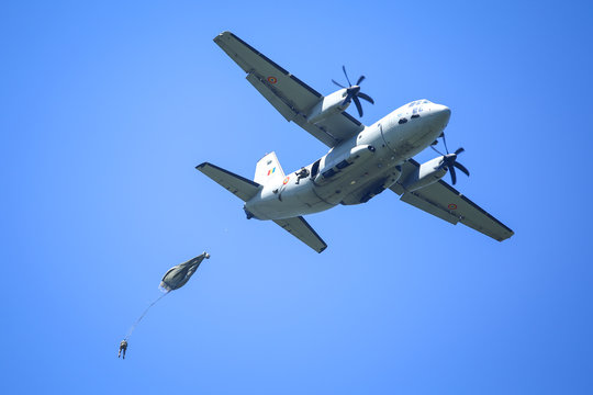 Military paratroopers jump from an Alenia C-27J Spartan military cargo plane.
