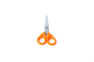 Orange scissor on white background.