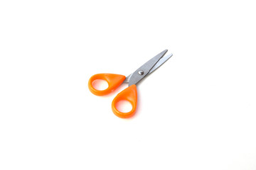 Orange scissor on white background.