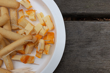 GOOD CHEESE DISH ON WOODEN TABLE A FOOD DAY IN THE FIELD