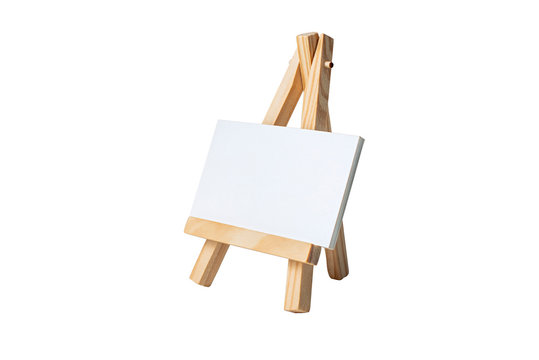 Mock Up Empty blank canvas on wooden easel isolated on white background.