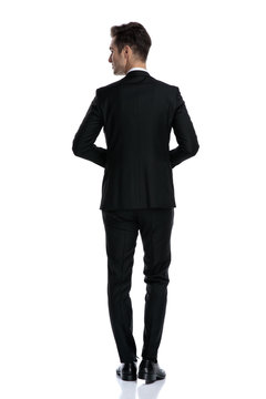 back view of young elegant man in tuxedo