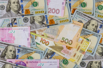 Fototapeta na wymiar Cash money finance investment American dollars banknotes and Ukrainian Money.