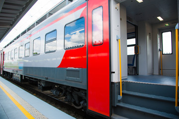 Obraz na płótnie Canvas Red train in modern railway