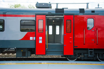 Red train in modern railway