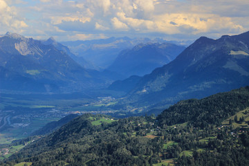 Naklejka premium Fabulously beautiful European cozy landscape in the cozy Alps mountains in Liechtenstein on the border with Austria. View of the Vaduz Valley from a height.