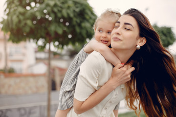 Fototapeta premium Mother with daughter. Family in a park. Cute little girl