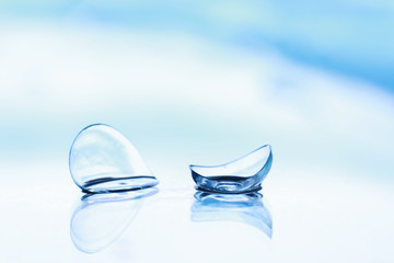 Tools for vision correction. Glasses and lenses with diopters on the background of splashes and...