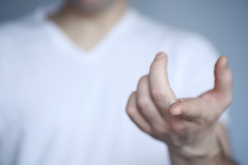 The concept of poor vision. Hold a contact lens and glasses in hand. A poster for advertising...